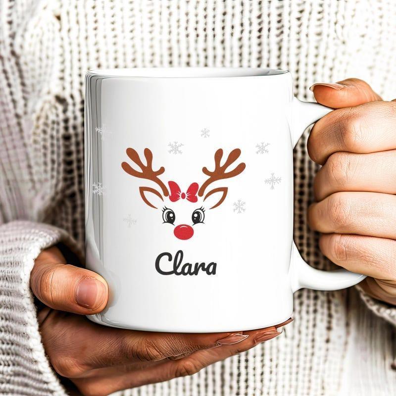 Tailorly White Ceramic 11 oz Mug - Clara Festive Reindeer Face With Red Bow Among Small Twinkling Stars Reindeer