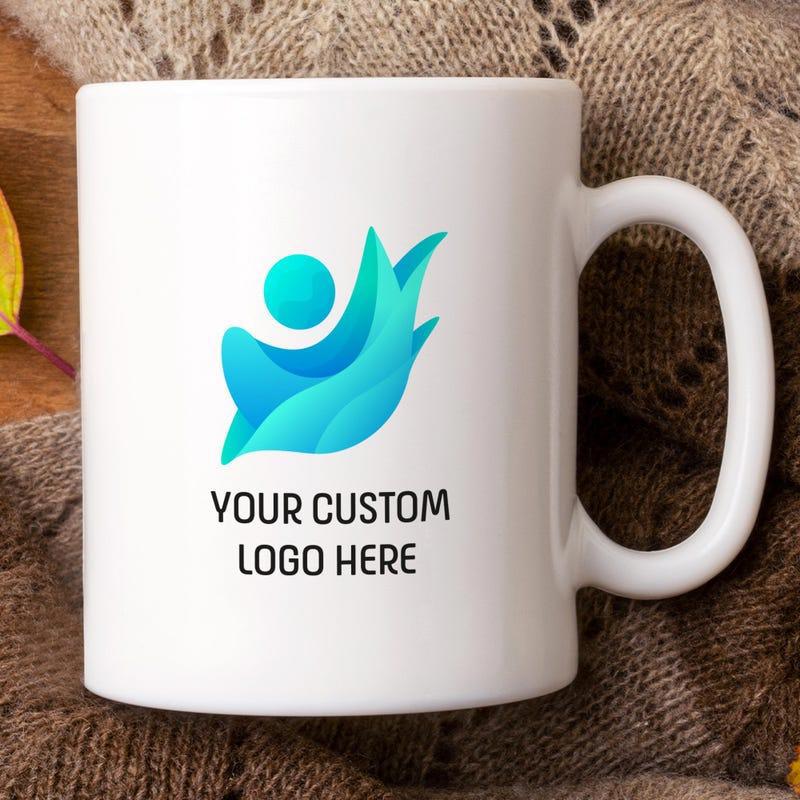 Tailorly White Ceramic 11 oz Mug - Your Custom Logo Here Vibrant Blue Abstract Flowing Wings With Stylized Circular Element Ceramic Mug