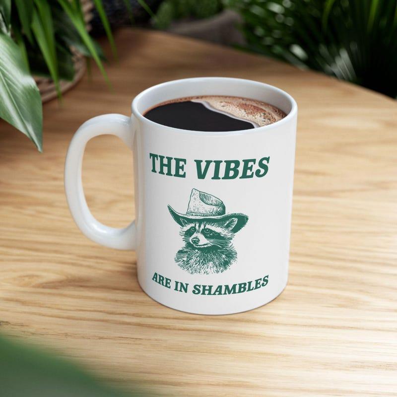Tailorly White Ceramic 11 oz Mug - The Vibes Are In Shambles Whimsical Sketch Style Raccoon Wearing A Classic Cowboy Hat Raccoon