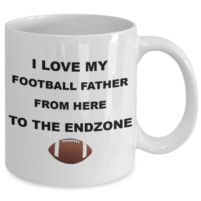Tailorly White Ceramic 11 oz Mug - I Love My Football Father From Here To The Endzone Brown Leather Ball Floating Below Bold Capitalized Black Decorative Lettering