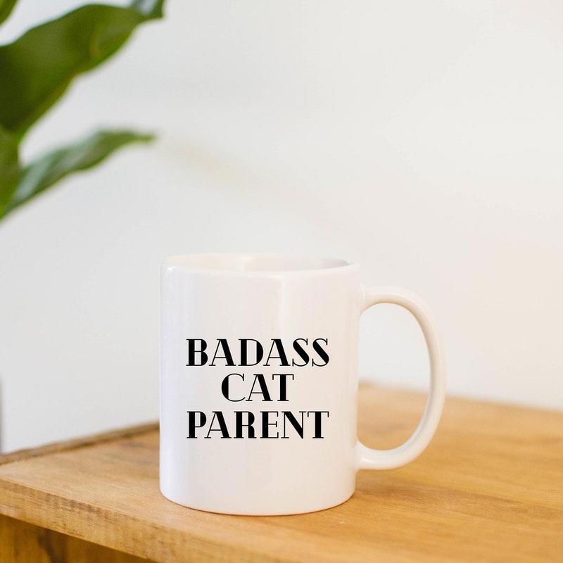 Tailorly White Ceramic 11 oz Mug - Badass Cat Parent Bold Black Serif Letters On A Simple White Background Mug