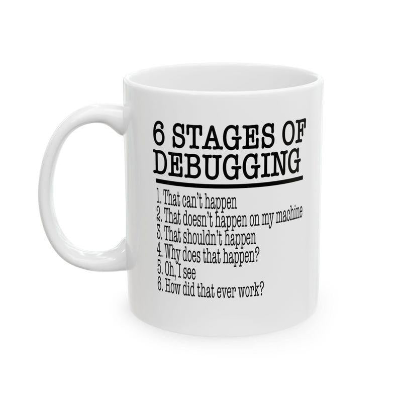 Tailorly White Ceramic 11 oz Mug - 6 Stages Of Debugging Minimalist Black Serif Typography Printed On Smooth Surface