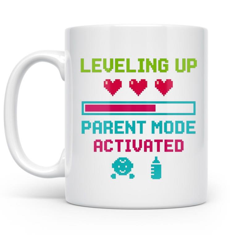 Tailorly White Ceramic 11 oz Mug - Leveling Up Parent Mode Activated Pixelated Hearts And Loading Bar Gaming Elements Mug