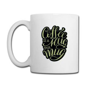 Tailorly White Ceramic 11 oz Mug - Coffee Is A Hug In A Mug Stylized Black Typography Inside Organic Shape Resting On Plain Surface Mug