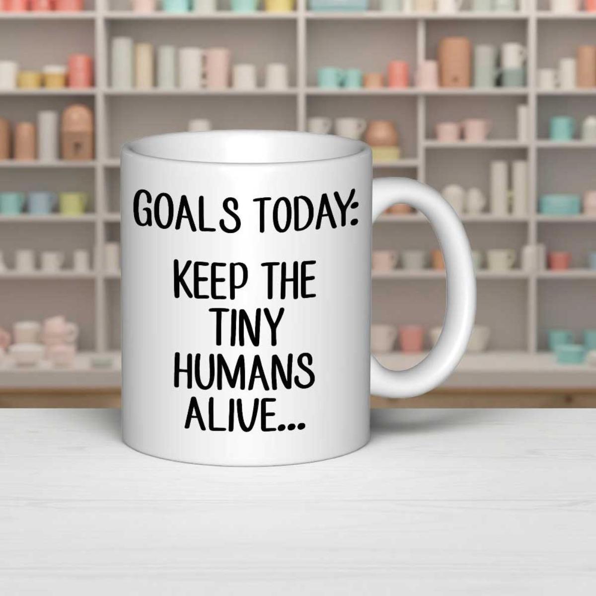 Tailorly White Ceramic 11 oz Mug - Goals Today Keep The Tiny Humans Alive Simple White Ceramic Vessel Featuring Bold Black Typography Mug