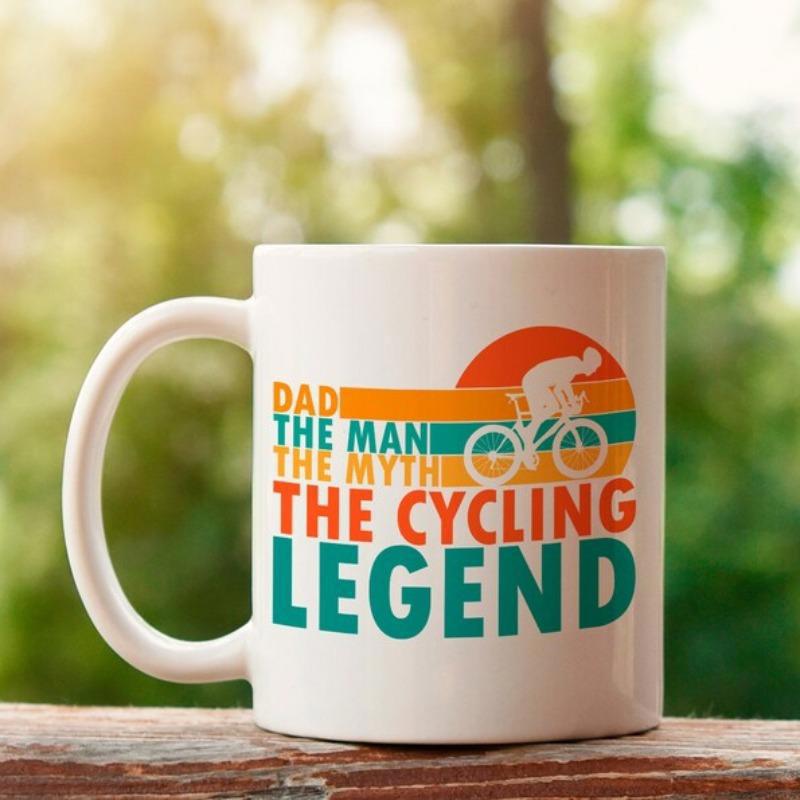 Tailorly White Ceramic 11 oz Mug - Dad The Man The Myth The Cycling Legend Retro Sunset Background With Silhouette Of Cyclist Riding Under Warm Golden Horizons