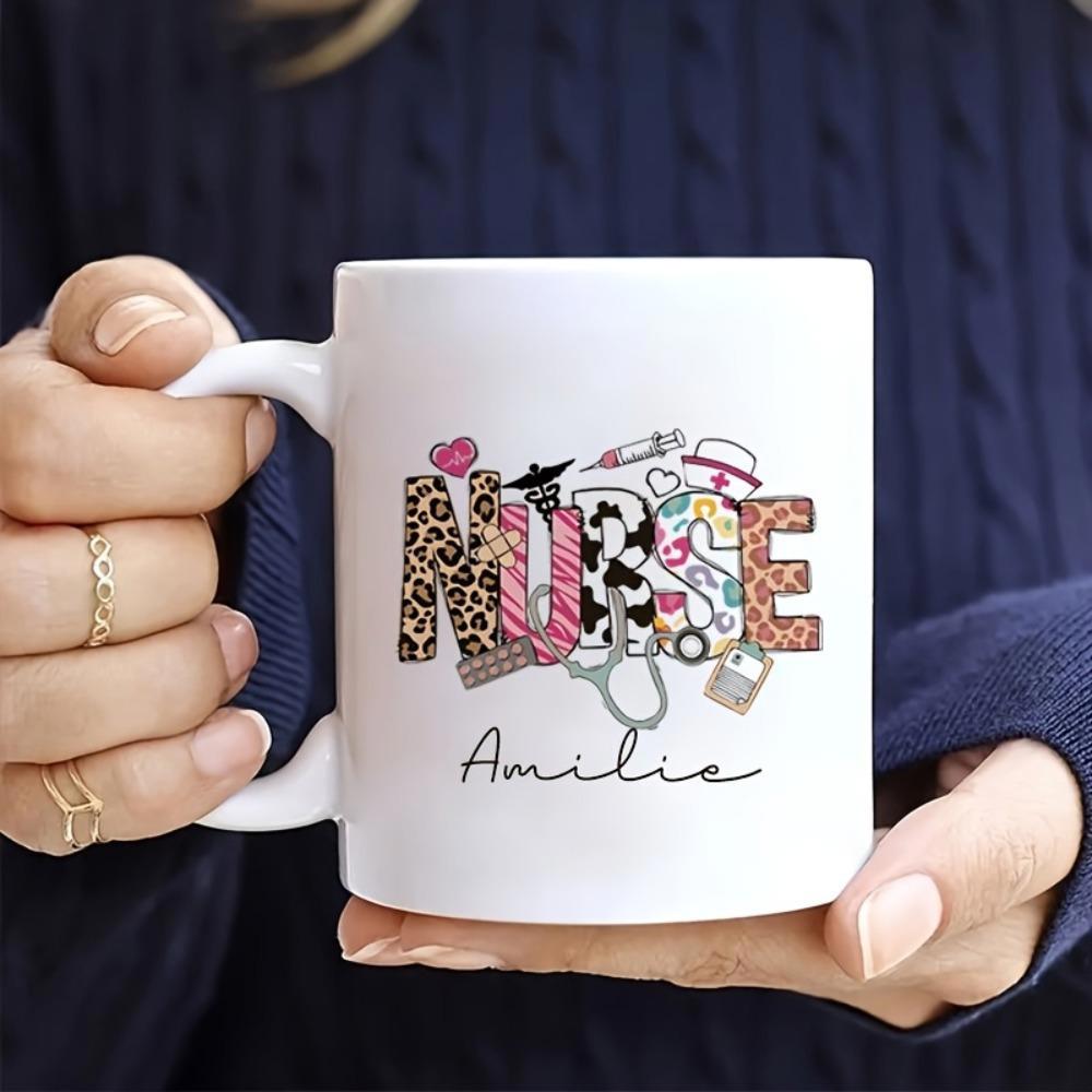 Tailorly White Ceramic 11 oz Mug - Nurse Amilie Artistic Medical Themed Letters With Leopard And Cow Patterns Beside Stethoscope Nurse