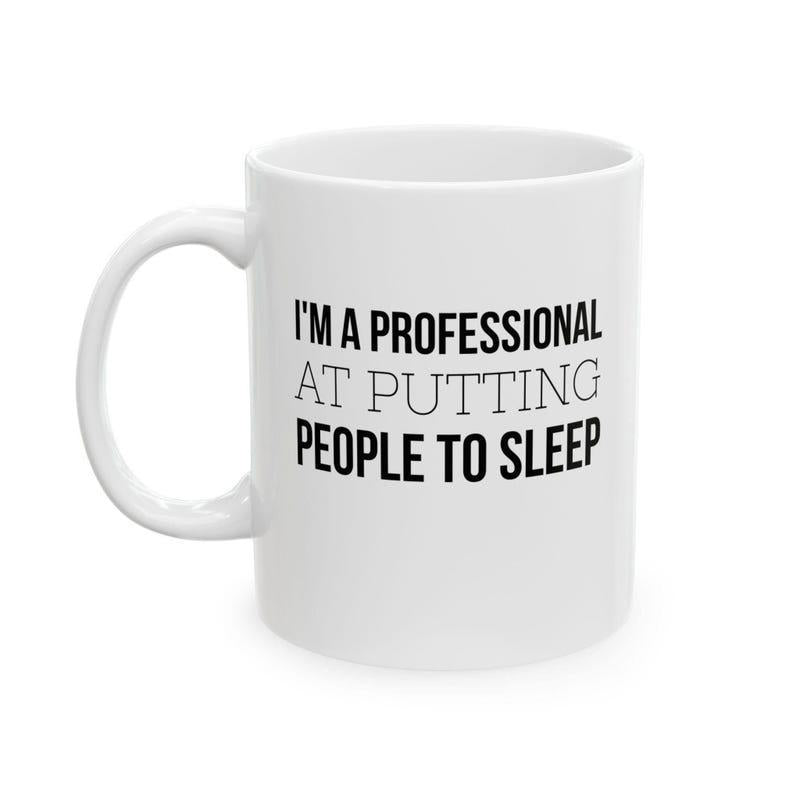 Tailorly White Ceramic 11 oz Mug - Im A Professional At Putting People To Sleep Minimalist Polished Ceramic Vessel With Solid Handle Under Bright Studio Light Mug