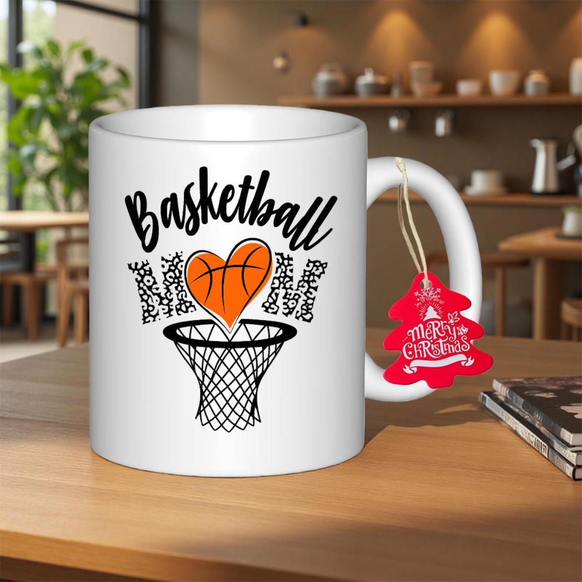 Tailorly White Ceramic 11 oz Mug - Basketball Mom Heart Shaped Orange Ball Falling Through Black Net Among Leopard Letters Basketball Hoop