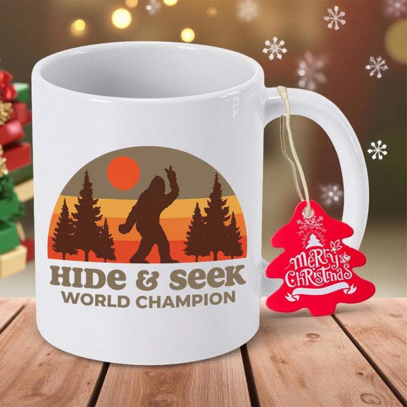 Tailorly White Ceramic 11 oz Mug - Hide Seek World Champion Mysterious Creature Walking Among Tall Pine Trees Against Retro Sunset Backdrop Sasquatch