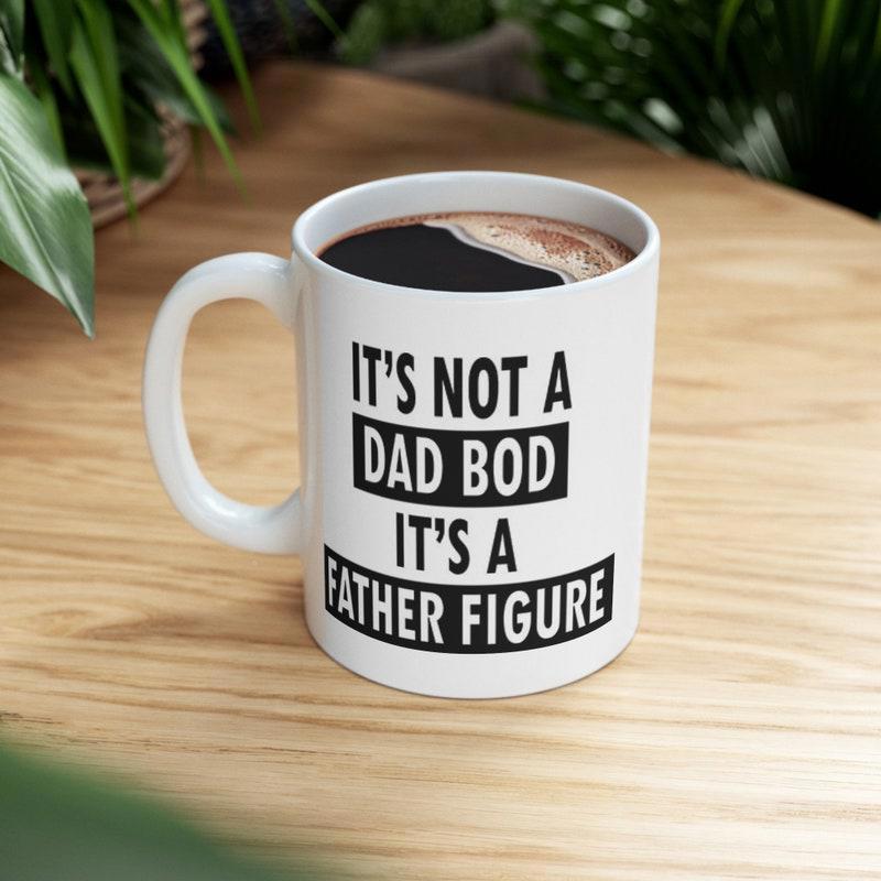 Tailorly White Ceramic 11 oz Mug - Its Not A Dad Bod Its A Father Figure Bold Block Typography Styled With Minimalist Black Decorative Bars Slogan