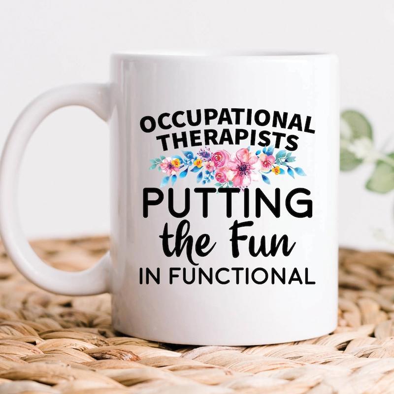 Tailorly White Ceramic 11 oz Mug - Occupational Therapists Putting The Fun In Functional Vibrant Pink And Blue Floral Arrangement With Delicate Green Leaves Among