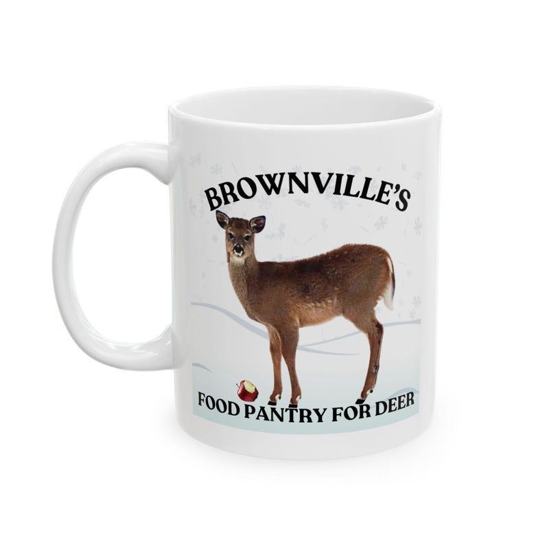 Tailorly White Ceramic 11 oz Mug - Brownvilles Food Pantry For Deer Majestic Brown Buck Standing In Soft Winter Snow With Apple Deer