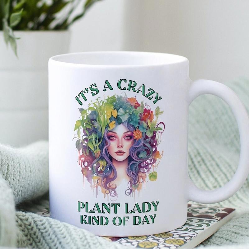 Tailorly White Ceramic 11 oz Mug - Its A Crazy Plant Lady Kind Of Day Whimsical Figure With Vibrant Floral Hair Surrounded By Lush Colorful Botanical Blooms Woman