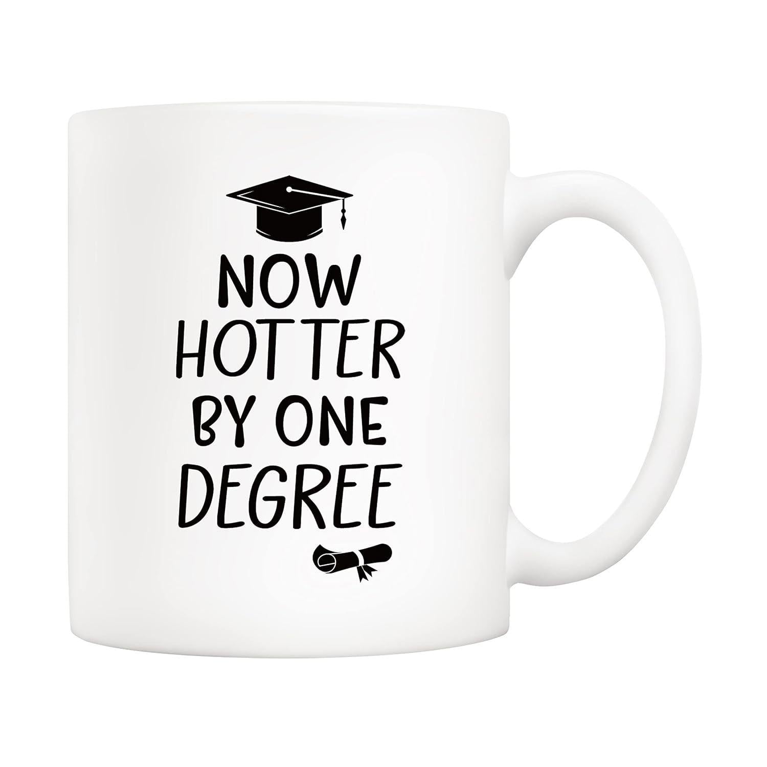 Tailorly White Ceramic 11 oz Mug - Now Hotter By One Degree Classic Black Graduation Cap And Rolled Diploma Set Against White Surface Mug