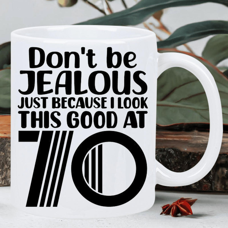 Tailorly White Ceramic 11 oz Mug - Don't Be Jealous Just Because I Look This Good At 70 Minimalist Bold Typography Featuring A Stylized Retro Graphic Number