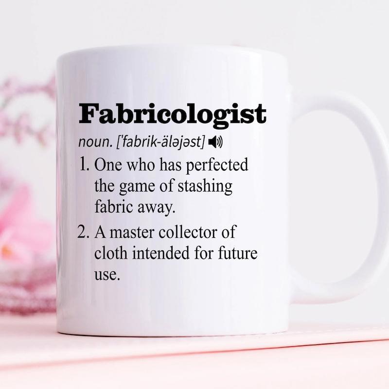 Tailorly White Ceramic 11 oz Mug - Fabricologist Minimalist Black Text Dictionary Definition Style Set Against A Smooth White Surface Mug