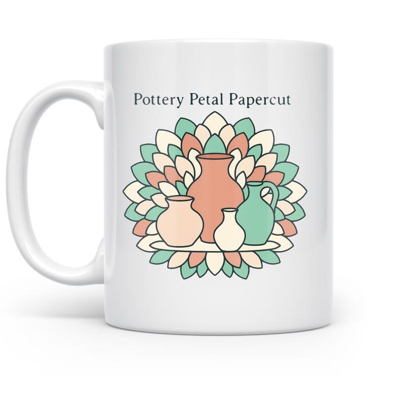 Tailorly White Ceramic 11 oz Mug - Pottery Petal Papercut Artistic Ceramic Vases Resting On Layers Of Vibrant Decorative Petals Vase