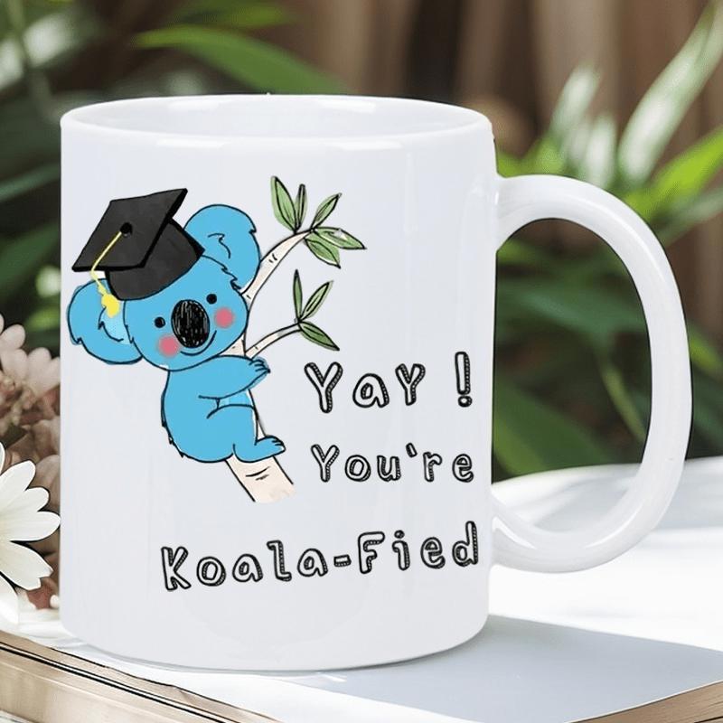 Tailorly White Ceramic 11 oz Mug - Yay Youre Koala Fied Cute Blue Cartoon Character Wearing Graduation Cap Holding Onto Bamboo Branch Koala
