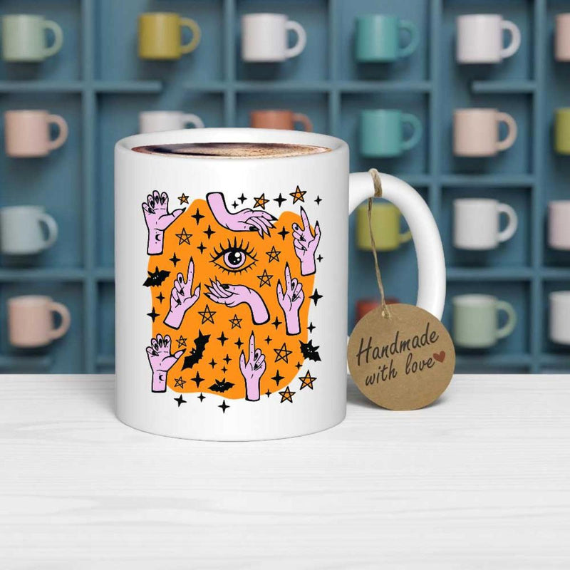 Tailorly White Ceramic 11 oz Mug - Handmade With Love Vibrant Orange Background Featuring Floating Purple Hands With Stars And Bats Eye