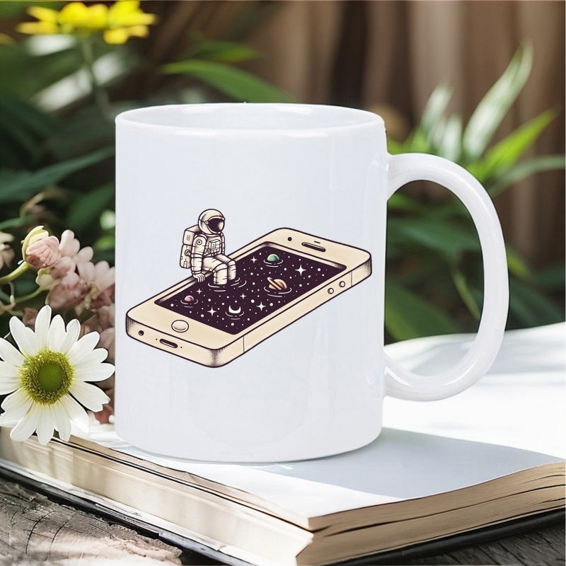 Tailorly White Ceramic 11 oz Mug - Whimsical Astronaut Sitting On A Glowing Smartphone Screen Featuring Galaxy Stars Astronaut