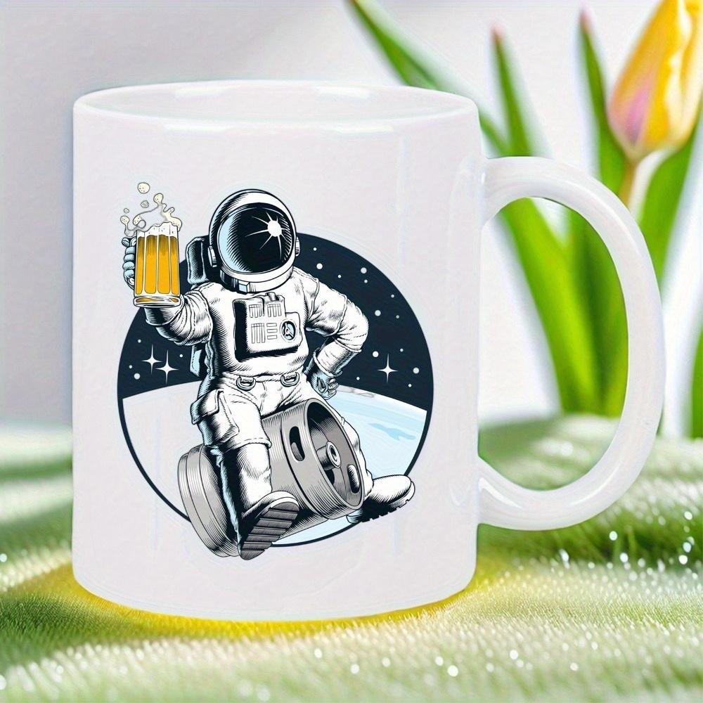 Tailorly White Ceramic 11 oz Mug - Whimsical Character Holding Foamy Beer Mug Sitting On A Metal Keg Astronaut