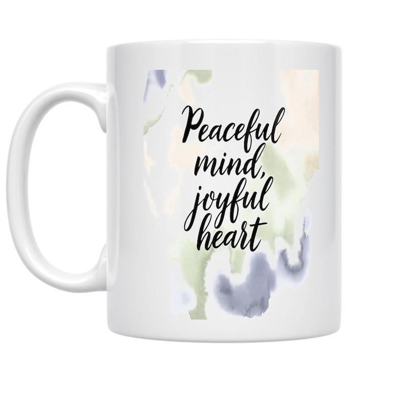 Tailorly White Ceramic 11 oz Mug - Peaceful Mind Joyful Heart Soft Watercolor Splashes Blending Naturally Behind Elegant Cursive Script Mug