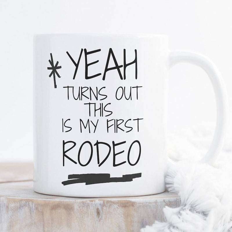 Tailorly White Ceramic 11 oz Mug - Yeah Turns Out This Is My First Rodeo Simple Black Handwritten Typography With Decorative Sparkle And Thick Underline Accent