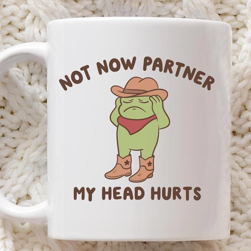 Tailorly White Ceramic 11 oz Mug - Not Now Partner My Head Hurts Sad Cartoon Green Frog Wearing A Brown Cowboy Hat Frog