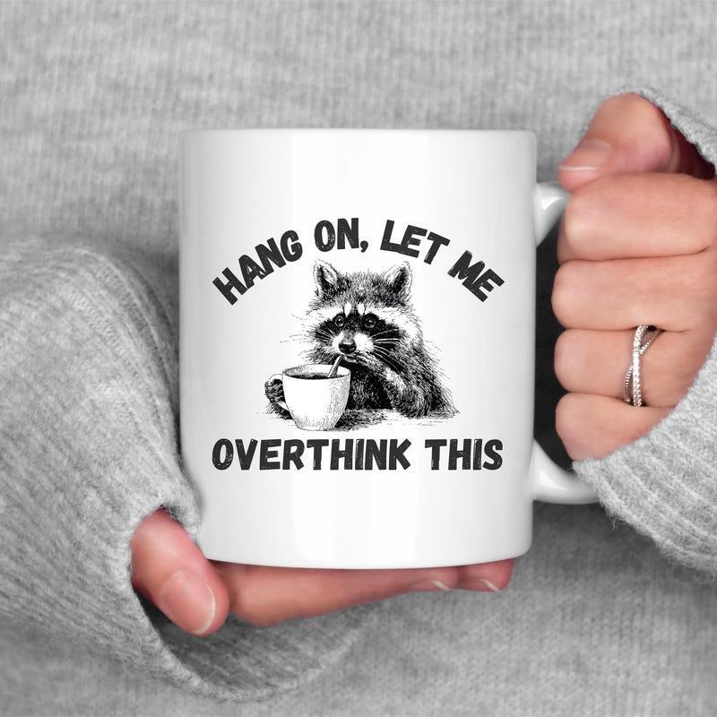 Tailorly White Ceramic 11 oz Mug - Hang On Let Me Overthink This Furry Animal Holding A Tiny Mug While Looking At Viewer Raccoon