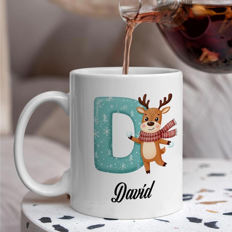Tailorly White Ceramic 11 oz Mug - David Adorable Cartoon Reindeer With Scarf Standing Beside Blue Snowflake Letter Reindeer