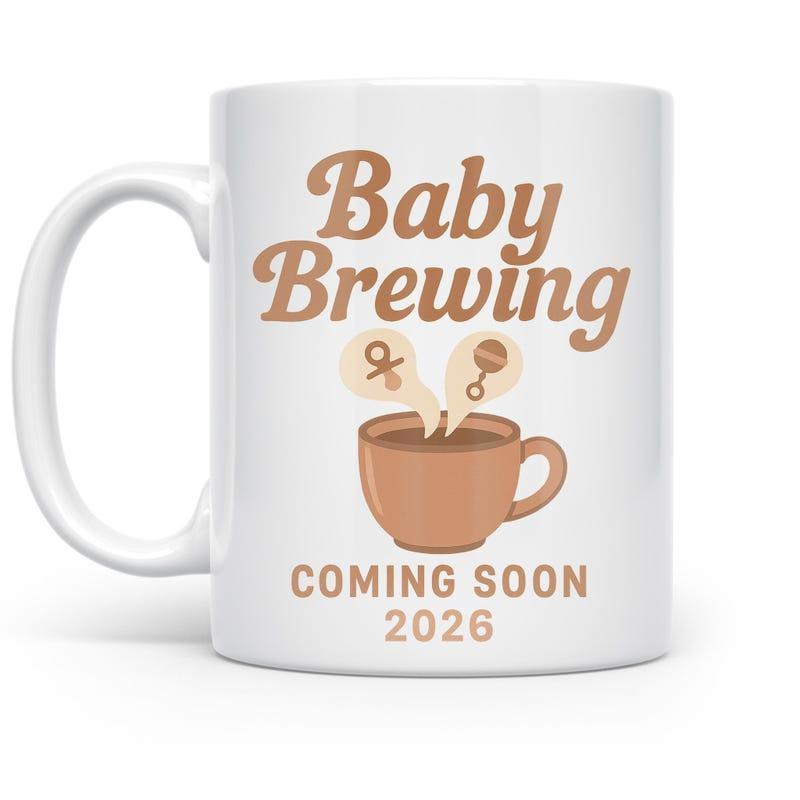 Tailorly White Ceramic 11 oz Mug - Baby Brewing Coming Soon 2026 Warm Coffee Cup With Steam Releasing Tiny Baby Rattle And Pacifier Mug
