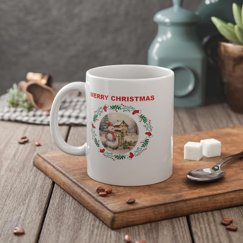 Tailorly White Ceramic 11 oz Mug - Merry Christmas Festive Wreath Surrounding A Vintage Style Snowy Winter Scene Snowman