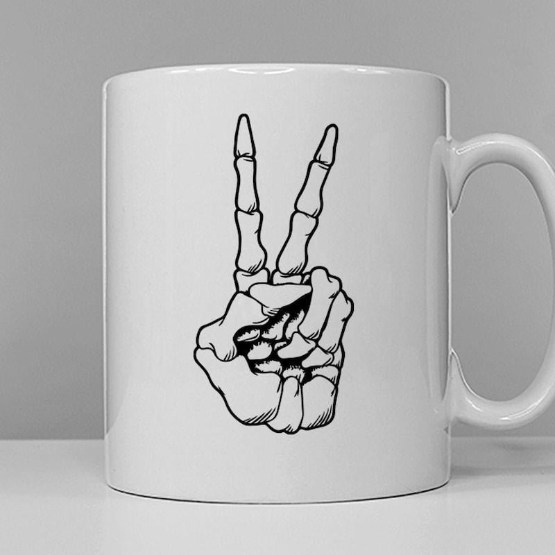 Tailorly White Ceramic 11 oz Mug - Hand Drawn Black Line Illustration Of A Bony Peace Gesture Skeleton Hand