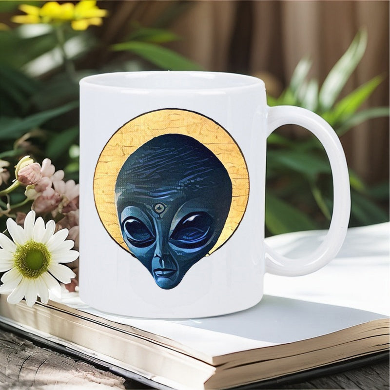 Tailorly White Ceramic 11 oz Mug - Golden Halo Behind Dark Blue Alien Head With Large Glistening Eyes Alien