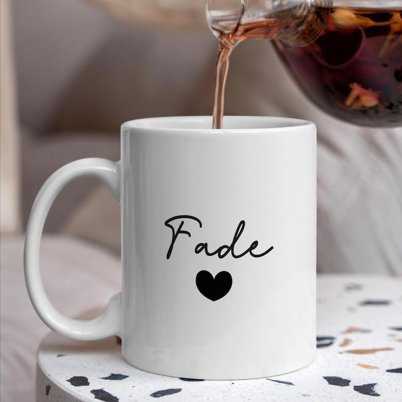 Tailorly White Ceramic 11 oz Mug - Fade Elegant Handwritten Script Floating Above A Tiny Solid Black Sweet Heart