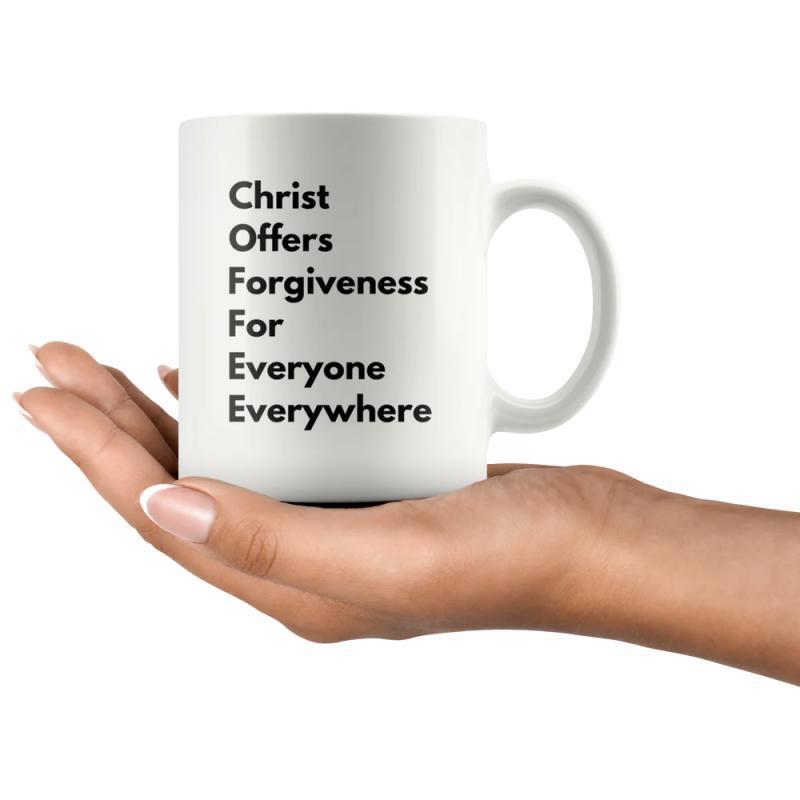 Tailorly White Ceramic 11 oz Mug - Christ Offers Forgiveness For Everyone Everywhere Simple Ceramic Minimalist Style Held By A Human Hand Graceful Mug