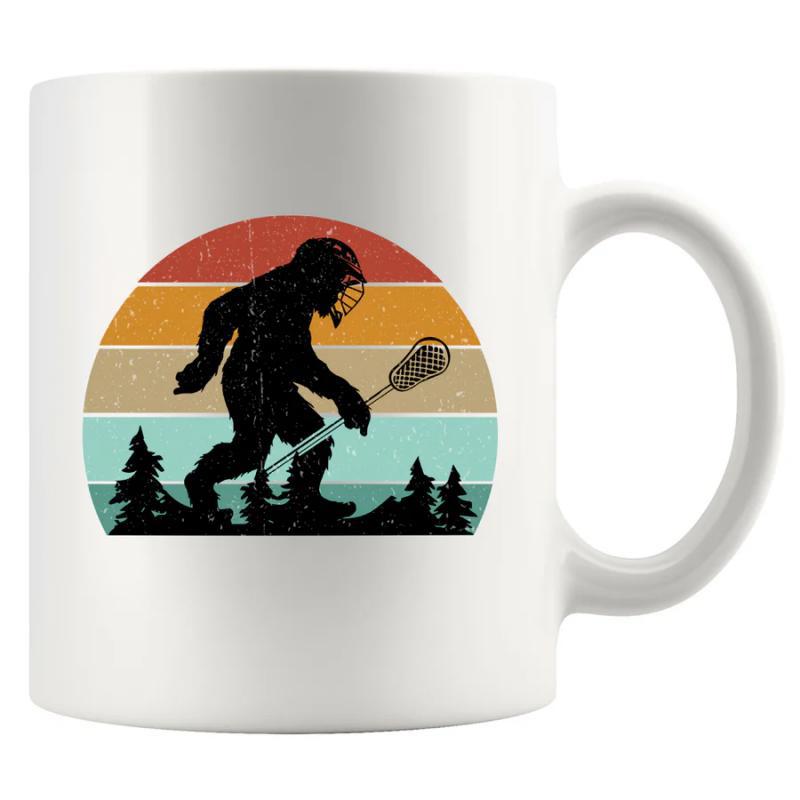 Tailorly White Ceramic 11 oz Mug - Vintage Distressed Retro Sunset Silhouette Carrying A Lacrosse Stick Past Pine Trees Bigfoot