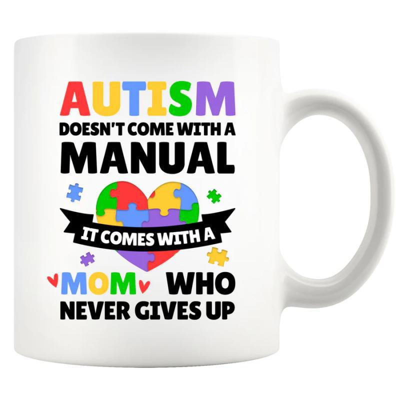 Tailorly White Ceramic 11 oz Mug - Autism Doesn't Come With A Manual It Comes With A Mom Who Never Gives Up Vibrant Multi Colored Jigsaw Pieces Arranged Within A