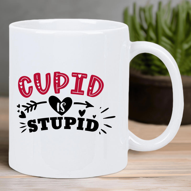 Tailorly White Ceramic 11 oz Mug - Cupid Is Stupid Bold Typography Design Featuring Arrow Piercing Through Black Heart