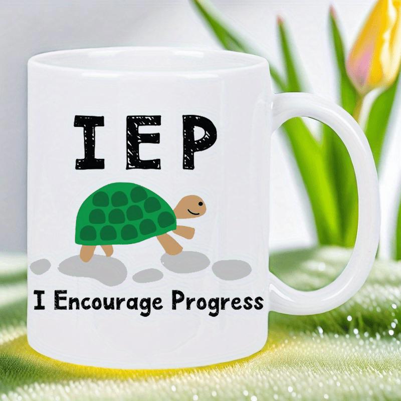 Tailorly White Ceramic 11 oz Mug - Iep I Encourage Progress Small Green Shelled Creature Moving Over Smooth Grey Rocks Under Text Turtle