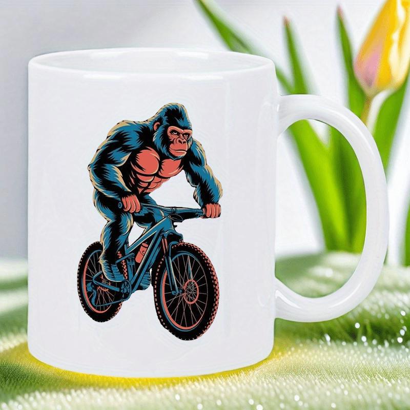 Tailorly White Ceramic 11 oz Mug - Powerful Muscular Primate Riding A Robust Mountain Bike Across Scenic Terrain Gorilla