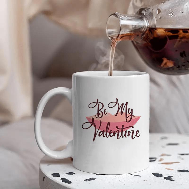 Tailorly White Ceramic 11 oz Mug - Be My Valentine Minimalist White Ceramic Coffee Cup Sitting On A Stone Surface Mug