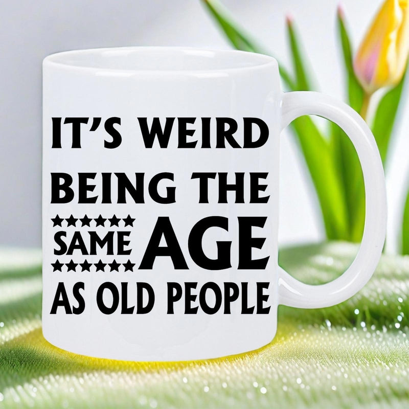Tailorly White Ceramic 11 oz Mug - Its Weird Being The Same Age As Old People Clean White Ceramic Design Featuring Bold Black Typography And Small Decorative Stars
