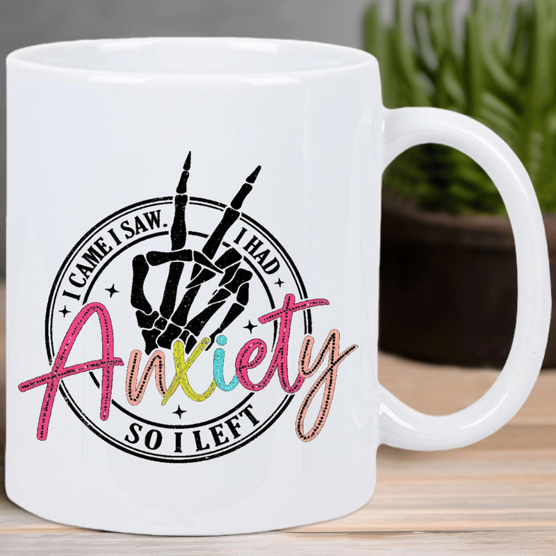 Tailorly White Ceramic 11 oz Mug - I Came I Saw I Had Anxiety So I Left Skeletal Hand Making Peace Sign Within A Circular Decorative Emblem Background Skeleton