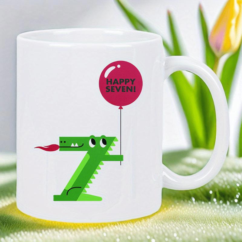 Tailorly White Ceramic 11 oz Mug - Happy Seven Playful Green Creature Shaped Like Number Seven Holding Round Red Balloon Crocodile