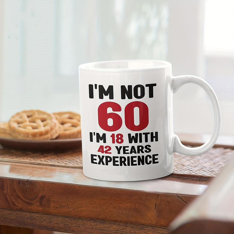 Tailorly White Ceramic 11 oz Mug - Im Not 60 Im 18 With 42 Years Experience White Ceramic Kitchenware Sitting On Wooden Surface With Decorative Cookies Mug