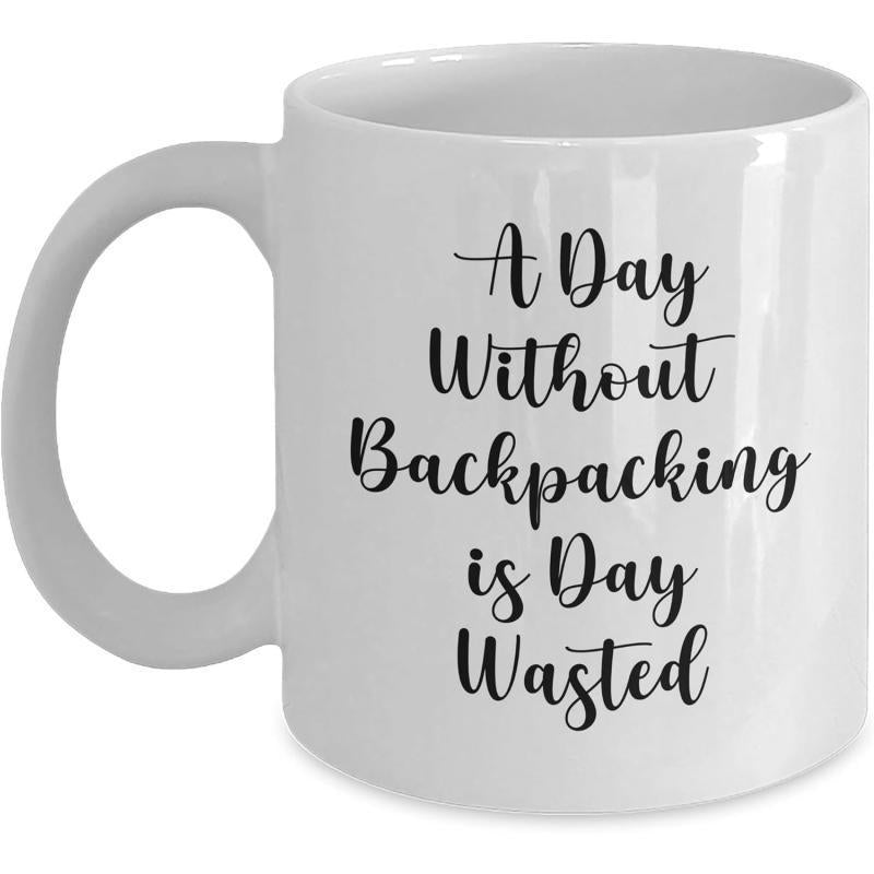 Tailorly White Ceramic 11 oz Mug - A Day Without Backpacking Is Day Wasted Simple Black Elegant Script Font Centered On White Surface Mug