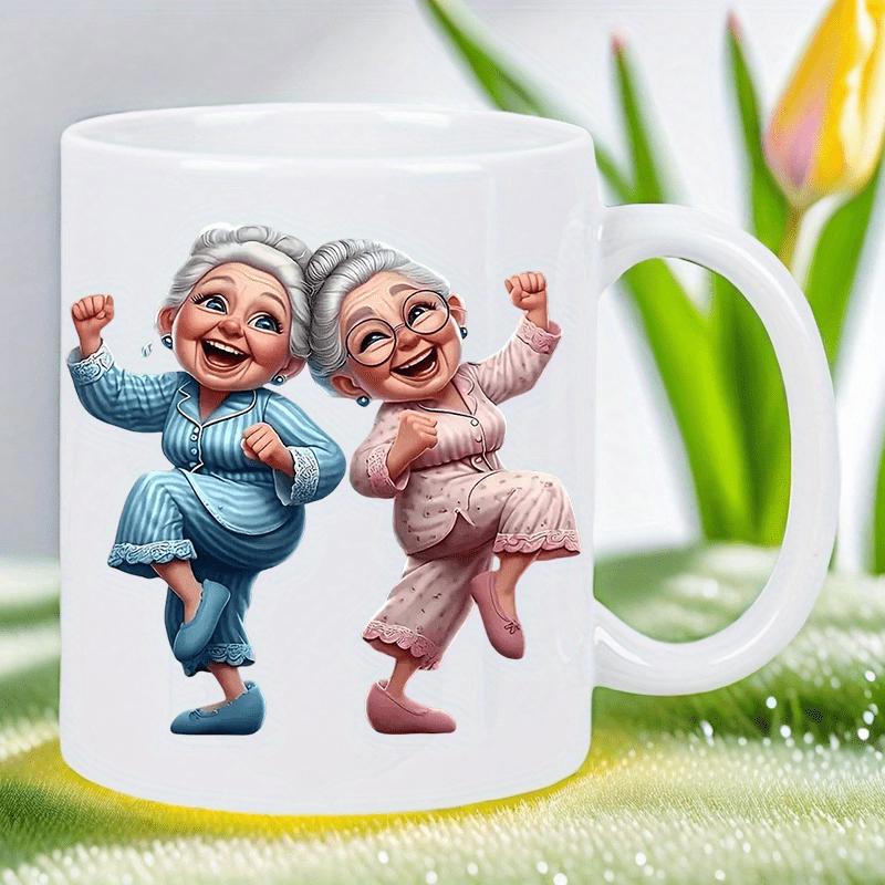 Tailorly White Ceramic 11 oz Mug - Two Cheerful Elderly Women Dancing Happily Wearing Colorful Pajamas Together Grandmas