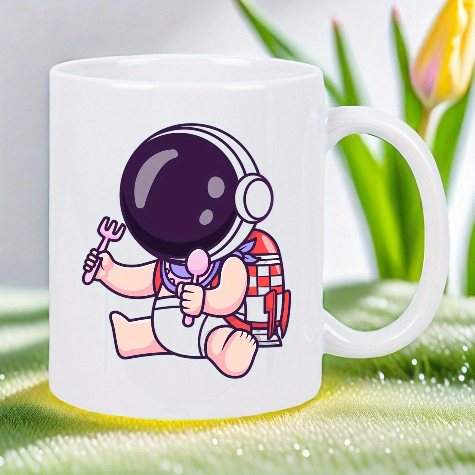 Tailorly White Ceramic 11 oz Mug - Adorable Little Astronaut Holding Dining Utensils While Sitting On The Surface Astronaut
